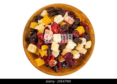 Vue de dessus de divers fruits tropicaux sucrés séchés dans une assiette en bois. Banque D'Images