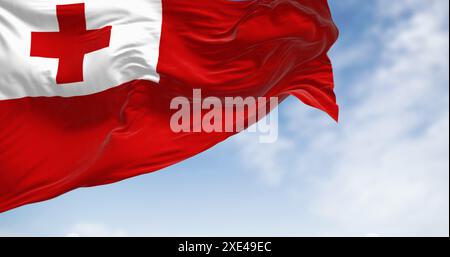 Drapeau national des Tonga agitant au vent par temps clair Banque D'Images