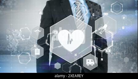 Image d'icônes médicales et formule chimique avec traitement de données sur homme d'affaires Banque D'Images