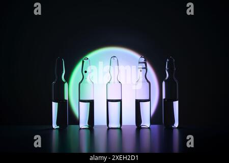 Plusieurs ampoules pour injection avec des médicaments sur un fond bleu. Banque D'Images