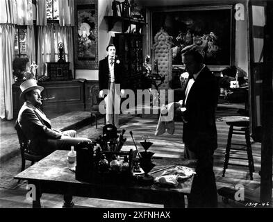 GEORGE SANDERS dans le rôle de Lord Henry Wotton HURD HATFIELD dans le rôle de Dorian Gray et LOWELL GILMORE dans LE RÔLE DE Basil Hallward dans L'IMAGE DE DORIAN GRAY 1945 réalisateur / scénario ALBERT LEWIN basé sur le roman d'Oscar Wilde direction artistique Cedric Gibbons et Hans Peters décor Edwin B. Willis musique Herbert Stothart costumes hommes Valles Producteur Pandro S. Berman Metro Goldwyn Mayer (MGM) Banque D'Images