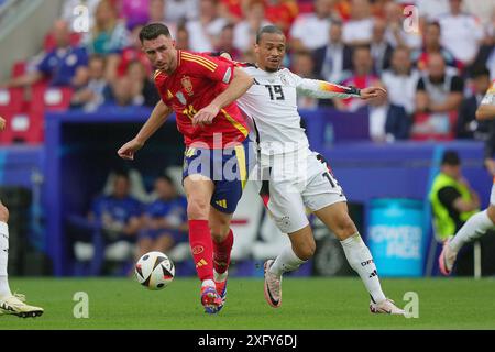 Stuttgart, Allemagne. 05 juillet, 2024.L'Espagnol Aymeric Laporte combat pour le ballon avec l'Allemand Leroy Sane lors du match de football Euro 2024 entre l'Espagne et l'Allemagne à la Stuttgart Arena, Stuttgart, Allemagne - vendredi 05 juillet 2024. Sport - Soccer . (Photo de Spada/LaPresse) crédit : LaPresse/Alamy Live News Banque D'Images