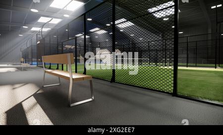 banc sur des courts de tennis de padel verts vides à l'intérieur d'un bâtiment d'entrepôt, situé dans la zone des installations sportives. Avec luminaires illuminés Banque D'Images