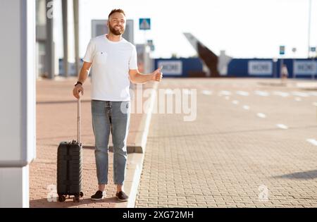 La capture de l'homme près de l'aéroport en taxi, essayer d'arrêter car Banque D'Images