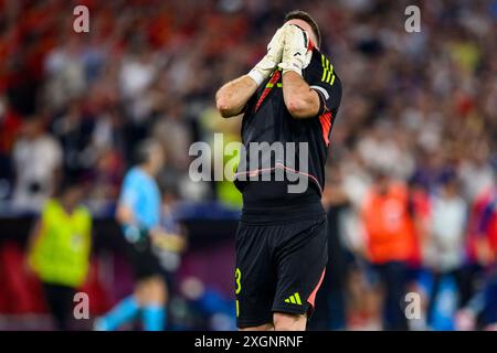 Munich, Allemagne. 09 juillet 2024. Football, UEFA Euro 2024, Championnat d'Europe, Espagne - France, finale, demi-finale, Munich Football Arena, le gardien de but espagnol Unai Simon célèbre la victoire après le match. Crédit : Tom Weller/dpa/Alamy Live News Banque D'Images