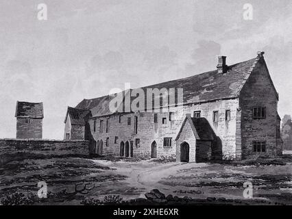 Aquatinte représentant l'ancien hôpital de Stevington, Bedfordshire, Angleterre, qui semble être un grand bâtiment en pierre avec une grande tour à gauche. Le bâtiment a un toit à pignons, une cheminée et plusieurs fenêtres. Il est entouré d'un mur de pierre bas et de quelques zones herbeuses. Banque D'Images