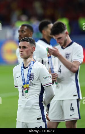 Berlin, Allemagne. 14 juillet 2024. L'Anglais Phil Foden réagit lors de la cérémonie de remise des prix après la finale de l'UEFA Euro 2024 entre l'Angleterre et l'Espagne à Berlin, Allemagne, le 14 juillet 2024. Crédit : Pan Yulong/Xinhua/Alamy Live News Banque D'Images