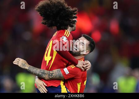 Berlin, Allemagne. 14 juillet 2024. L'Espagnol Marc Cucurella (G) célèbre avec Alex Baena la finale de l'UEFA Euro 2024 entre l'Angleterre et l'Espagne à Berlin, Allemagne, le 14 juillet 2024. Crédit : Zhang Fan/Xinhua/Alamy Live News Banque D'Images