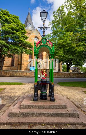 La fontaine Cherub à l'extérieur de la cathédrale de Dornoch, Dornoch, Caithness, Écosse Banque D'Images