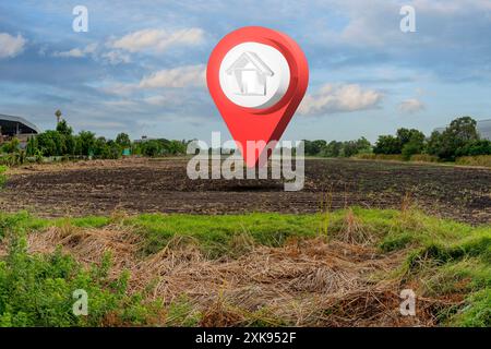 Symbole de maison avec icône de broche d'emplacement sur le sol de récupération de marais fissuré sec vide dans la vente immobilière ou le concept d'investissement immobilier, l'achat de la nouvelle maison fo Banque D'Images