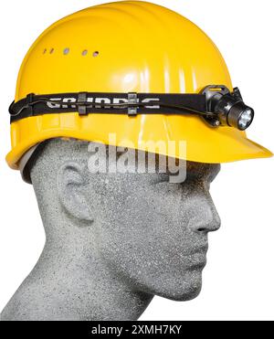 Casque de sécurité jaune avec phare sur un mannequin Banque D'Images