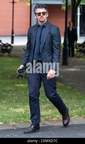 Joey Barton arrive au Warrington Combined Crown and Magistrates court Centre où il est accusé d'infraction de communication malveillante. L'accusation concerne des tweets qu'il a envoyés concernant Eni Aluko, spécialiste du football à la télévision, lors d'un match de la FA Cup qu'elle commentait pour la BBC en janvier. Date de la photo : mardi 30 juillet 2024. Banque D'Images