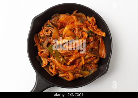 Assaisonnement d'estomac de porc sauté sur fond blanc Banque D'Images