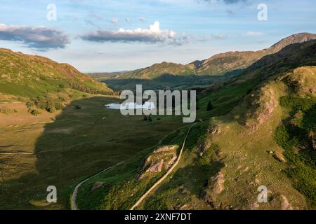 blea tarn région du lac au coucher du soleil regardant au sud du brochet latéral vers le château howe pas de personnes vue élevée Banque D'Images