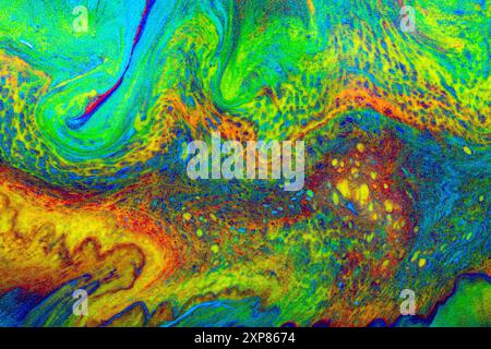 Texture créée avec de la peinture acrylique avec l'effet coulant avec des couleurs vibrantes et complémentaires créant une texture adaptée aux arrière-plans et au graphique Banque D'Images