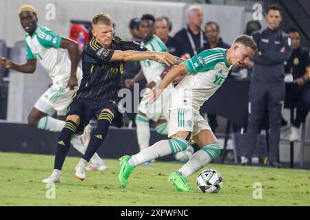 Los Angeles, Californie, États-Unis. 7 août 2024. Mateusz Bogusz #19 du Los Angeles FC et Jon Gallagher #17 de l'Austin FC se disputent le ballon lors d'un match de la Coupe des ligues au BMO Stadium, le 7 août 2024 à Los Angeles. (Crédit image : © Ringo Chiu/ZUMA Press Wire) USAGE ÉDITORIAL SEULEMENT! Non destiné à UN USAGE commercial ! Crédit : ZUMA Press, Inc/Alamy Live News Banque D'Images