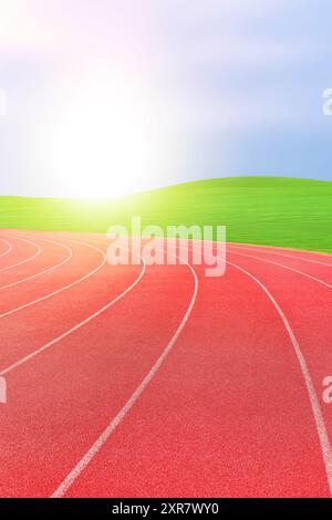 Athlétisme piste de course dans un stade au coucher du soleil.- arrière-plans sportifs Banque D'Images