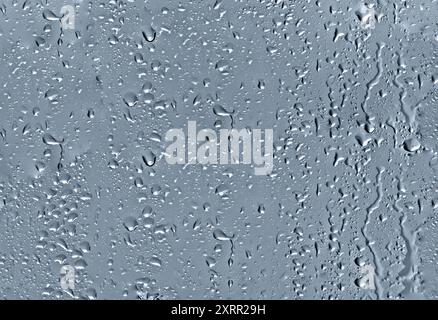 gouttes d'eau sur le motif sans couture abstrait en verre Banque D'Images