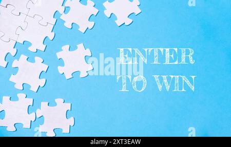 Un puzzle avec les mots entrer pour gagner écrit au-dessus Banque D'Images