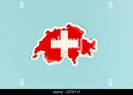 Carte Suisse avec couleurs du drapeau suisse sur fond bleu Banque D'Images