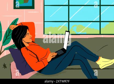 Femme en pull orange se relaxant avec son ordinateur portable dans un environnement domestique confortable par une grande fenêtre. Banque D'Images