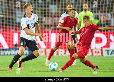 Ulm, Allemagne. 16 août 2024. Luka Hyrylaeinen, SSV ULM 38 Competition for the ball, Tackling, duel, header, zweikampf, action, lutte contre Joshua KIMMICH, FCB 6 Raphael Guerreiro, FCB 22 dans le match SSV ULM - FC BAYERN MUENCHEN 0-4 DFB-Pokal, Coupe d'Allemagne de Football, 1.round le 16 août 2024 à Ulm, Allemagne. Saison 2024/2025 photographe : ddp images/STAR-images - LA RÉGLEMENTATION DFB INTERDIT TOUTE UTILISATION DE PHOTOGRAPHIES comme SÉQUENCES D'IMAGES et/ou QUASI-VIDÉO - crédit : ddp Media GmbH/Alamy Live News Banque D'Images