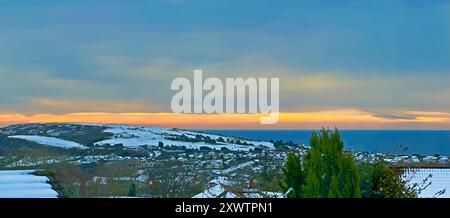 Onchan couvert de neige dans l'île de Man dans la lumière du soir Banque D'Images