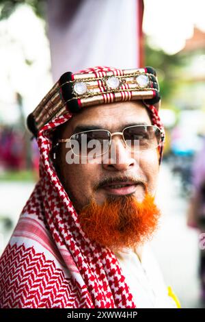 Portrait d'un malais portant un keffiyeh arabe à Georgetown, Penang, Malaisie. Banque D'Images