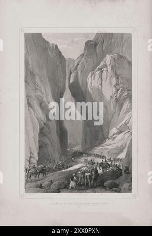 Première guerre anglo-afghane. Entrée au col de Bolan depuis Dadur. 1840-1850. Croquis de Jas. Atkinson, esq. Quittant le campement de Dadur pour Kundye, à une distance de onze milles et demi, les troupes entrèrent alors dans le col de Bolan, qui est représenté sur ce dessin, la route étant rugueuse et galettisée, entre des collines de sable, parsemées de silex et de pierres de chaux de toutes tailles, l'espace en largeur entre les montagnes variant de trois à quatre cents mètres à une trentaine. Comme le torrent dans le col court de façon détournée d'un côté de la gorge à l'autre, l'armée a été obligée de le traverser six ou sept Banque D'Images