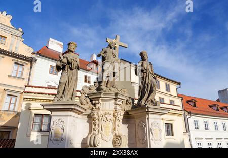 Statue of the Holy Savior with Cosmas and Damian on Charles Bridge, Prague, Czech Republic. Stock Photo