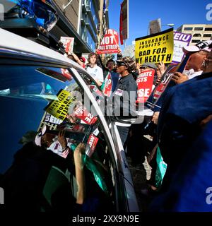 Les partisans du projet de loi sur les soins de santé se rassemblent à Washington et protestent devant le Ritz Carlton, où les compagnies d'assurance maladie étaient rassemblées pour leur réunion annuelle. Banque D'Images