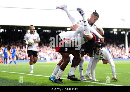 Fulham's Alex Iwobi (centre) celebrates scoring their side's second goal of the game with team-mates during the Premier League match at Craven Cottage, London. Picture date: Saturday August 24, 2024. Stock Photo