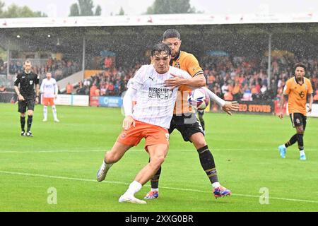 Cledara Abbey Stadium, Cambridge on Saturday 24th August 2024. Kyle Joseph (9 Blackpool) challenged by Danny Andrew (3 Cambridge United) during the Sky Bet League 1 match between Cambridge United and Blackpool at the Cledara Abbey Stadium, Cambridge on Saturday 24th August 2024. (Photo: Kevin Hodgson | MI News) Credit: MI News & Sport /Alamy Live News Stock Photo