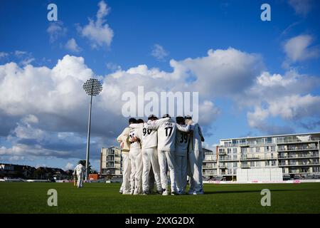 Bristol, UK, 24 August 2024. Gloucestershire huddle during the Vitality County Championship Division Two match between Gloucestershire and Leicestershire. Credit: Robbie Stephenson/Gloucestershire Cricket/Alamy Live News Stock Photo