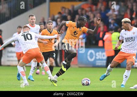 Cledara Abbey Stadium, Cambridge on Saturday 24th August 2024. Sonny Carey (10 Blackpool) challenges Emmanuel Longelo (45 Cambridge United) during the Sky Bet League 1 match between Cambridge United and Blackpool at the Cledara Abbey Stadium, Cambridge on Saturday 24th August 2024. (Photo: Kevin Hodgson | MI News) Credit: MI News & Sport /Alamy Live News Stock Photo