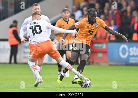 Cledara Abbey Stadium, Cambridge on Saturday 24th August 2024. Sonny Carey (10 Blackpool) challenges Emmanuel Longelo (45 Cambridge United) during the Sky Bet League 1 match between Cambridge United and Blackpool at the Cledara Abbey Stadium, Cambridge on Saturday 24th August 2024. (Photo: Kevin Hodgson | MI News) Credit: MI News & Sport /Alamy Live News Stock Photo