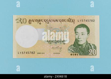 Billet de banque Bhoutan de 20 Ngultrum représentant le portrait du roi Jigme Dorji Wangchuck Banque D'Images