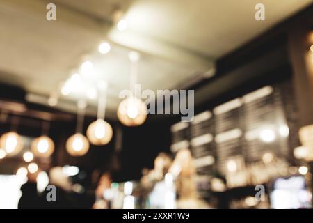 Café loft flou avec le barista et le client. Banque D'Images