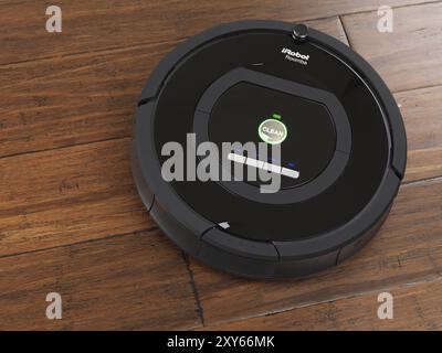 Robot aspirateur domestique iRobot Roomba 770 sur plancher de bois franc Banque D'Images