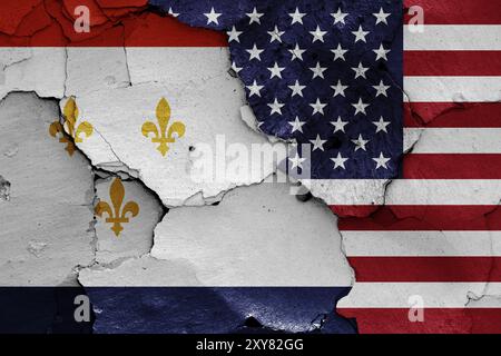 Drapeaux de la Nouvelle-Orléans et des États-Unis peints sur un mur fissuré Banque D'Images