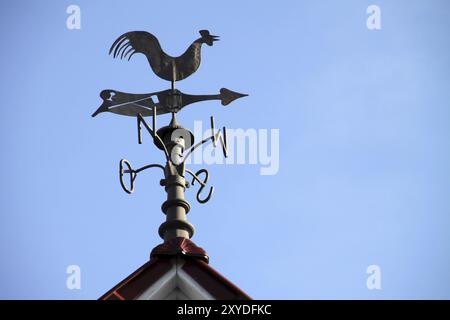 Weathercock sur un toit à Lothe Banque D'Images