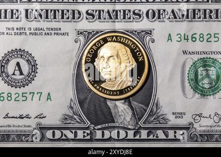 Une pièce d'un dollar, George Washington, sur un billet d'un dollar. Gros plan, photo macro Banque D'Images