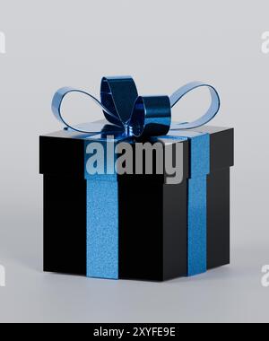 Boîte cadeau noire avec un noeud bleu Banque D'Images
