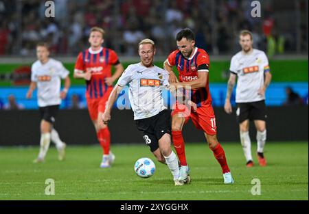 Zweikampf, Aktion Mikkel Rygaard (18) BK Haecken gegen Denis Thomalla 1. FC Heidenheim 1846 FCH (11) 1. FC Heidenheim v. BK Haecken, Fussball, Conference League, Play Off, Rueckspiel, saison 2024/25, 29.08.2024 Foto : Eibner-Pressefoto/Michael Weber Banque D'Images