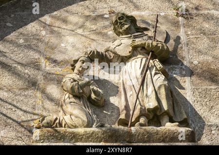 L'apôtre saint Jacques baptisant Lupa scène Queen bas-relief en pierre sur l'église de Saint-Jacques, Padron Espagne Banque D'Images