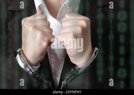 Libre d'un homme menotté dans un costume foncé Banque D'Images