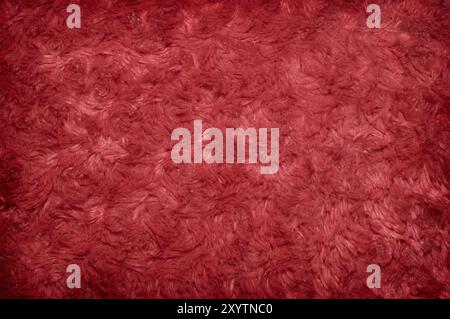 Fond rouge de texture de polyester velu Banque D'Images