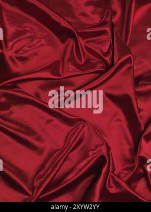 Fond tissu soyeux rouge brillant Banque D'Images