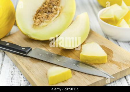 Melon de miel sur fond de bois rustique (gros plan) Banque D'Images