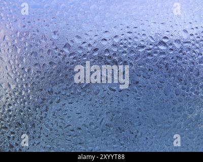 Gouttes d'eau et de givre sur les vitres Banque D'Images